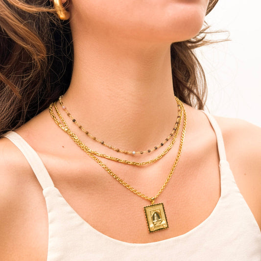 Model wearing 18K Gold Vermeil Chains from SOIL Jewelry