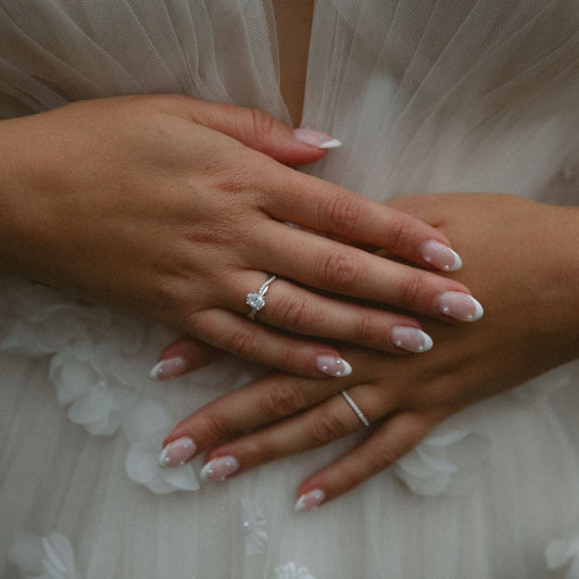 Close up of hands of solid Gold Half Eternity Wedding Band handcrafted by SOIL Jewelry
