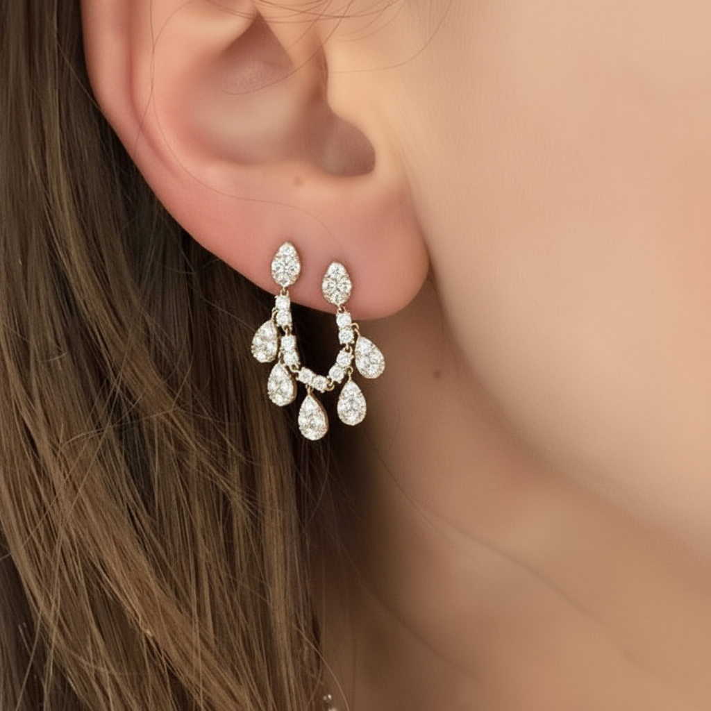 Woman wearing solid gold diamond earrings handcrafted by SOIL Jewelry