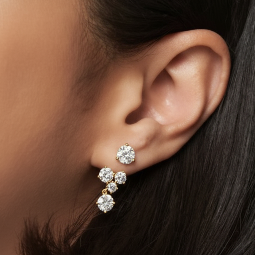 Woman wearing solid gold diamond earrings handcrafted by SOIL Jewelry